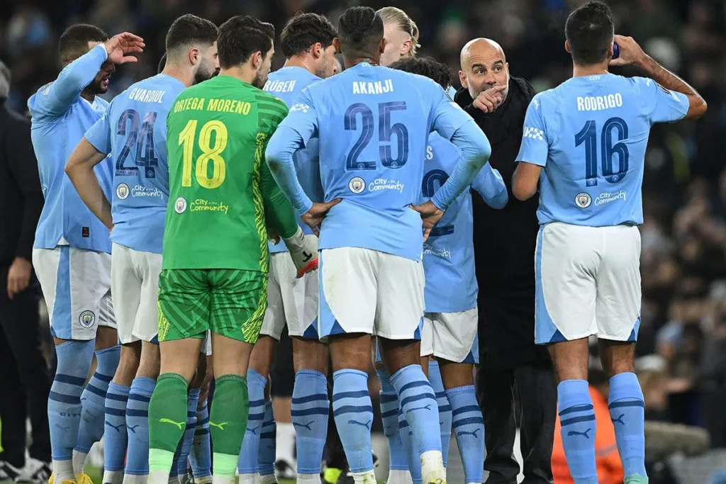 Pep Guardiola gives instructions to Manchester City players