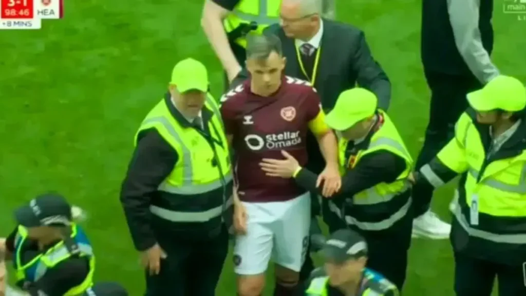 Celtic’s Championship Win Sparks Scandal as Fans Attack Hearts Captain on the Pitch